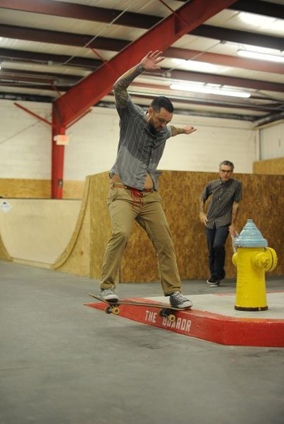 Justin Frontside Tailslides the Red Curb