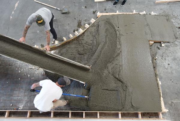 The Concrete Truck Pours the Red Curb