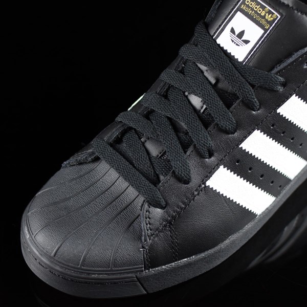 black leather adidas superstars